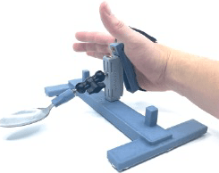 Hand demonstrating assistive grasping device